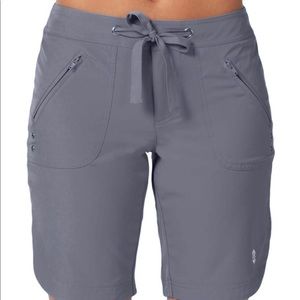 NWT. Free Country woman’s khaki Bermuda board short size M, new in bag with tags